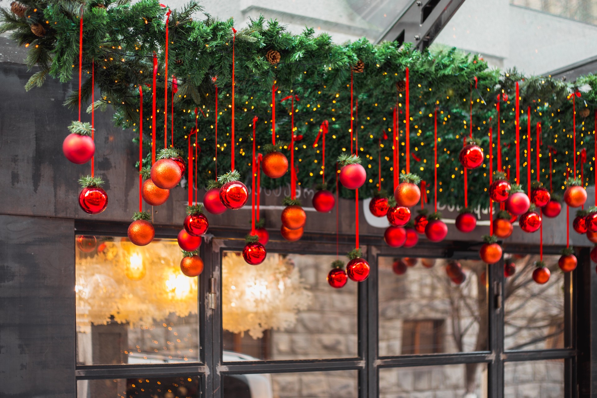 New Year red balls decorate the facade of the hotel and shop